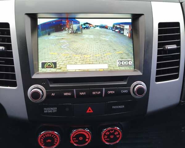 Красный Мицубиси Аутлендер, объемом двигателя 2.36 л и пробегом 93 тыс. км за 11499 $, фото 32 на Automoto.ua