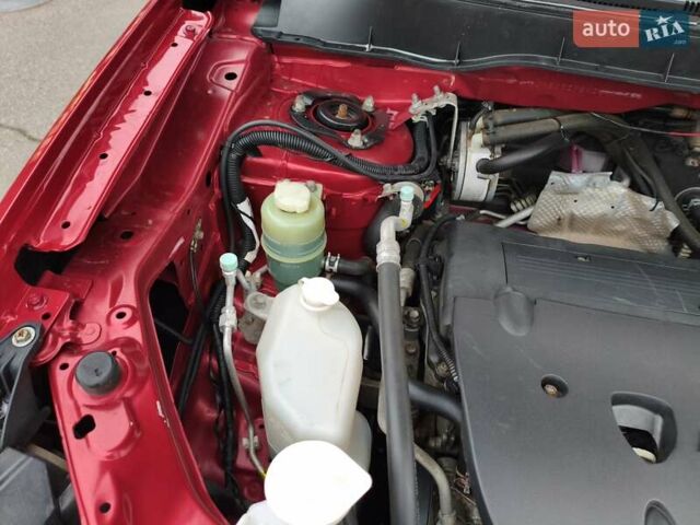 Красный Мицубиси Аутлендер, объемом двигателя 2.36 л и пробегом 93 тыс. км за 11499 $, фото 37 на Automoto.ua