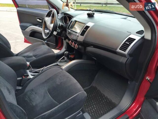 Красный Мицубиси Аутлендер, объемом двигателя 2.36 л и пробегом 93 тыс. км за 11499 $, фото 27 на Automoto.ua