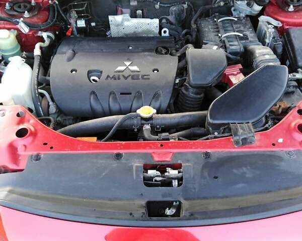 Червоний Міцубісі Аутлендер, об'ємом двигуна 2.4 л та пробігом 175 тис. км за 12800 $, фото 6 на Automoto.ua