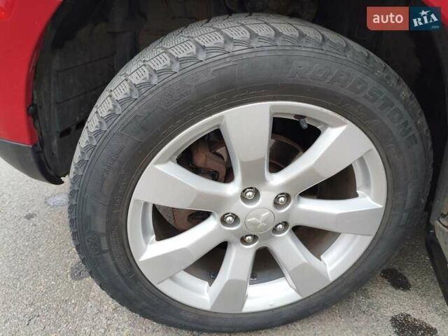 Красный Мицубиси Аутлендер, объемом двигателя 2.36 л и пробегом 93 тыс. км за 11499 $, фото 34 на Automoto.ua