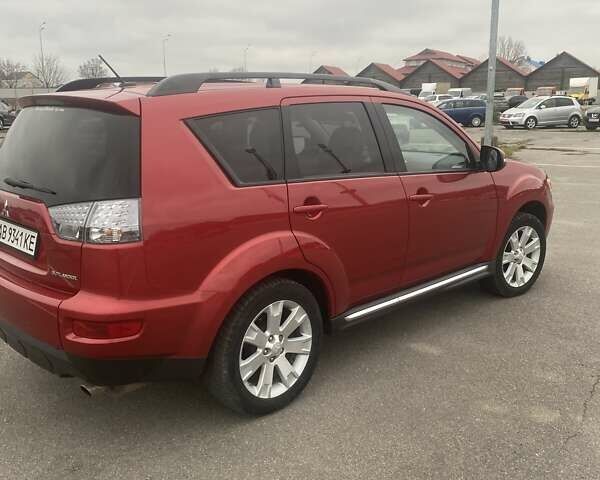 Красный Мицубиси Аутлендер, объемом двигателя 2.36 л и пробегом 210 тыс. км за 11800 $, фото 4 на Automoto.ua