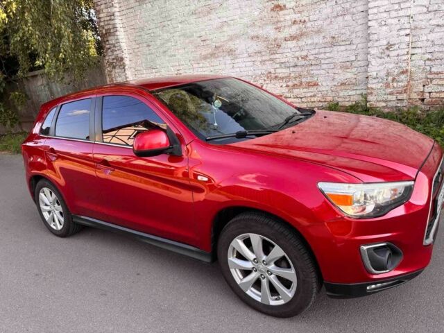 Красный Мицубиси Аутлендер, объемом двигателя 2 л и пробегом 200 тыс. км за 9100 $, фото 1 на Automoto.ua