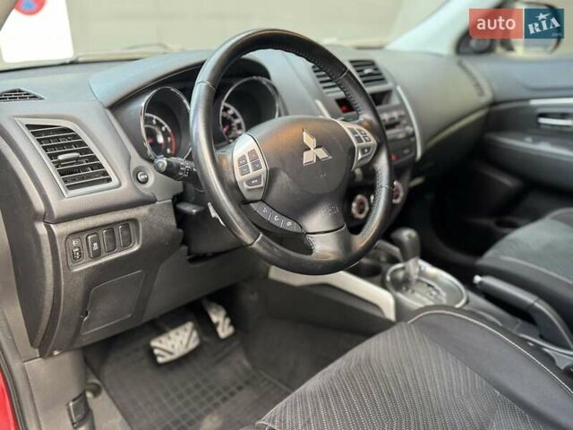 Червоний Міцубісі Аутлендер, об'ємом двигуна 2 л та пробігом 96 тис. км за 10950 $, фото 26 на Automoto.ua