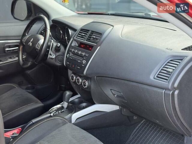 Червоний Міцубісі Аутлендер, об'ємом двигуна 2 л та пробігом 96 тис. км за 10950 $, фото 11 на Automoto.ua