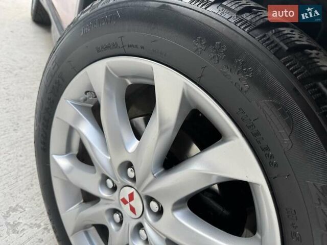 Червоний Міцубісі Аутлендер, об'ємом двигуна 2 л та пробігом 96 тис. км за 10950 $, фото 45 на Automoto.ua