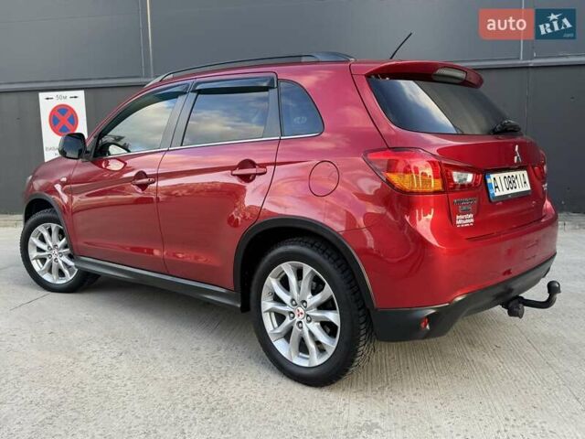 Червоний Міцубісі Аутлендер, об'ємом двигуна 2 л та пробігом 96 тис. км за 10950 $, фото 49 на Automoto.ua
