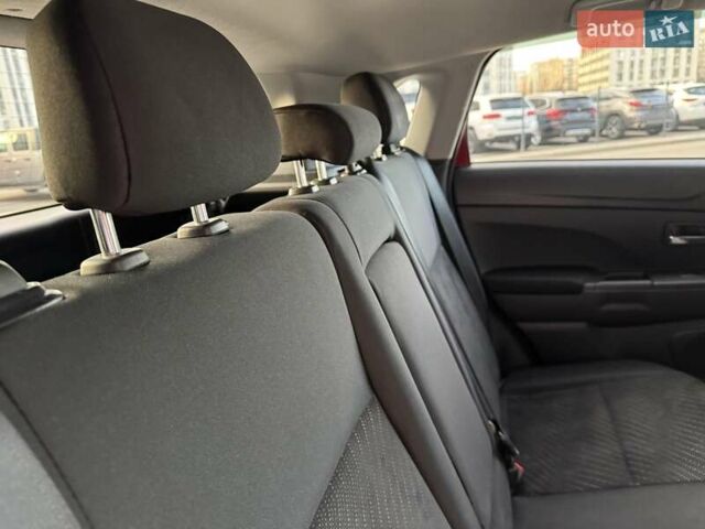 Червоний Міцубісі Аутлендер, об'ємом двигуна 2 л та пробігом 96 тис. км за 10950 $, фото 21 на Automoto.ua