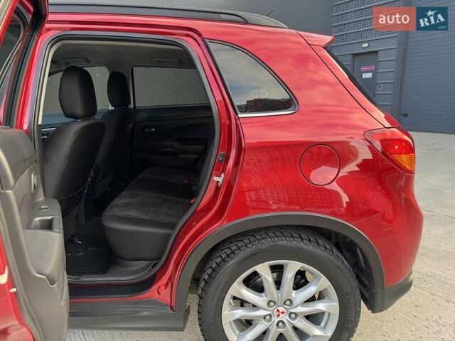 Червоний Міцубісі Аутлендер, об'ємом двигуна 2 л та пробігом 96 тис. км за 10950 $, фото 27 на Automoto.ua