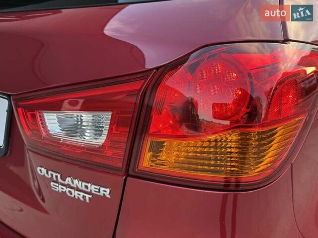 Червоний Міцубісі Аутлендер, об'ємом двигуна 2 л та пробігом 96 тис. км за 10950 $, фото 35 на Automoto.ua