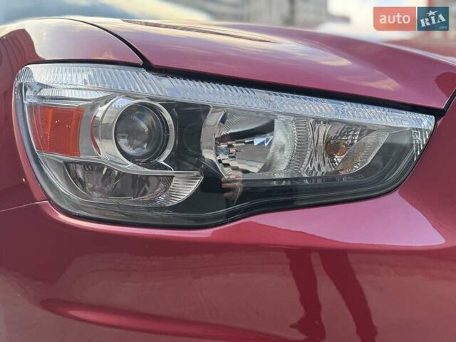 Червоний Міцубісі Аутлендер, об'ємом двигуна 2 л та пробігом 96 тис. км за 10950 $, фото 42 на Automoto.ua