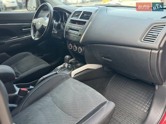 Червоний Міцубісі Аутлендер, об'ємом двигуна 2 л та пробігом 96 тис. км за 10950 $, фото 29 на Automoto.ua