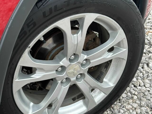 Красный Мицубиси Аутлендер, объемом двигателя 2.4 л и пробегом 213 тыс. км за 11900 $, фото 3 на Automoto.ua