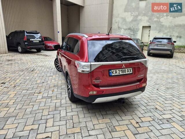 Красный Мицубиси Аутлендер, объемом двигателя 3 л и пробегом 119 тыс. км за 14000 $, фото 3 на Automoto.ua