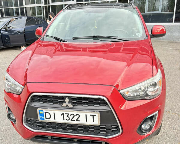 Красный Мицубиси Аутлендер, объемом двигателя 2 л и пробегом 210 тыс. км за 13500 $, фото 1 на Automoto.ua