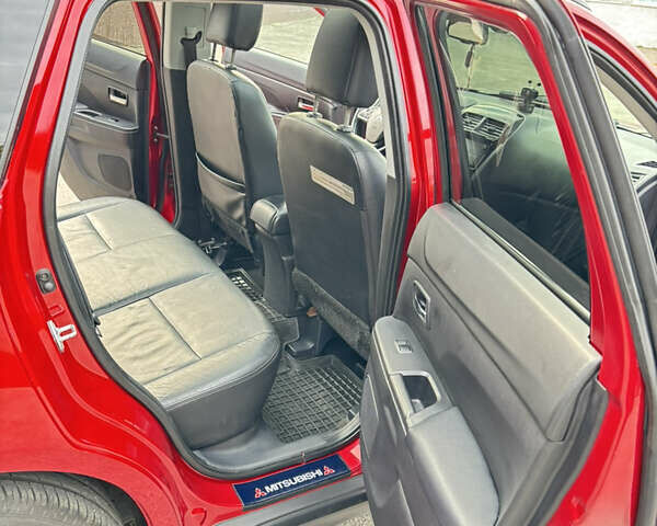 Красный Мицубиси Аутлендер, объемом двигателя 2 л и пробегом 210 тыс. км за 13500 $, фото 13 на Automoto.ua