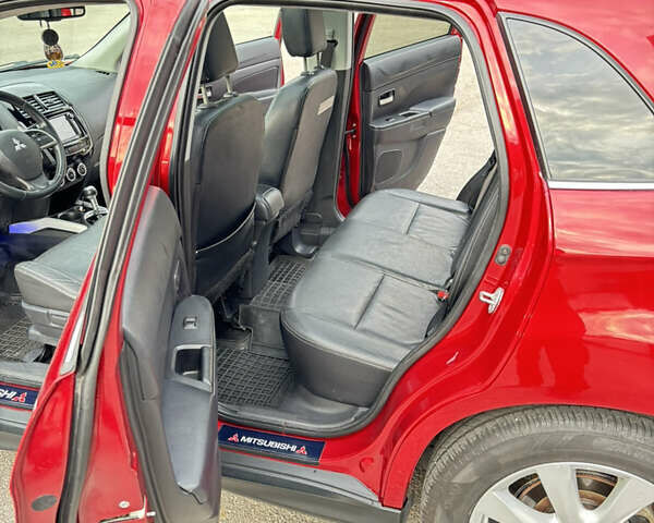 Красный Мицубиси Аутлендер, объемом двигателя 2 л и пробегом 210 тыс. км за 13500 $, фото 12 на Automoto.ua