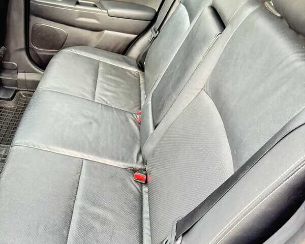 Красный Мицубиси Аутлендер, объемом двигателя 2 л и пробегом 210 тыс. км за 13500 $, фото 17 на Automoto.ua