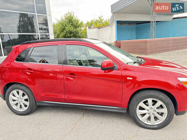 Красный Мицубиси Аутлендер, объемом двигателя 2 л и пробегом 210 тыс. км за 13500 $, фото 3 на Automoto.ua