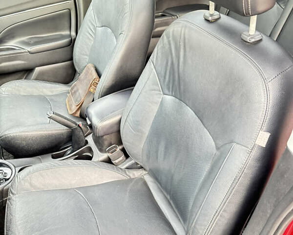 Красный Мицубиси Аутлендер, объемом двигателя 2 л и пробегом 210 тыс. км за 13500 $, фото 16 на Automoto.ua