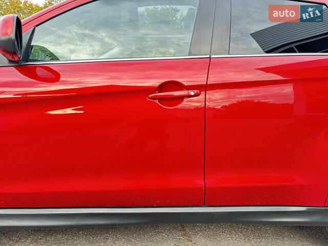 Красный Мицубиси Аутлендер, объемом двигателя 2 л и пробегом 210 тыс. км за 13500 $, фото 5 на Automoto.ua