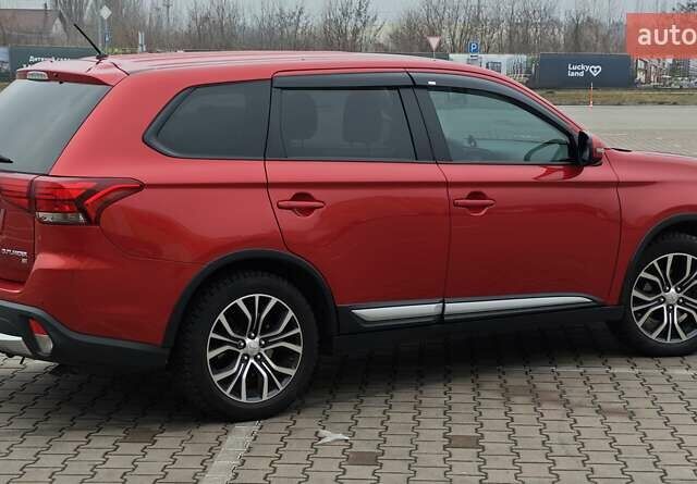 Красный Мицубиси Аутлендер, объемом двигателя 2.36 л и пробегом 123 тыс. км за 15300 $, фото 5 на Automoto.ua