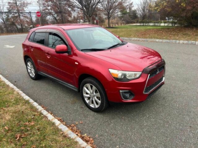 Червоний Міцубісі Аутлендер, об'ємом двигуна 2 л та пробігом 75 тис. км за 9000 $, фото 2 на Automoto.ua