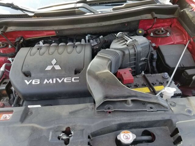 Червоний Міцубісі Аутлендер, об'ємом двигуна 3 л та пробігом 58 тис. км за 19000 $, фото 3 на Automoto.ua