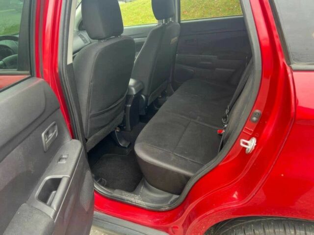 Червоний Міцубісі Аутлендер, об'ємом двигуна 2 л та пробігом 75 тис. км за 9000 $, фото 9 на Automoto.ua