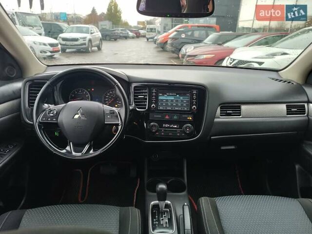 Красный Мицубиси Аутлендер, объемом двигателя 2.36 л и пробегом 172 тыс. км за 12300 $, фото 13 на Automoto.ua