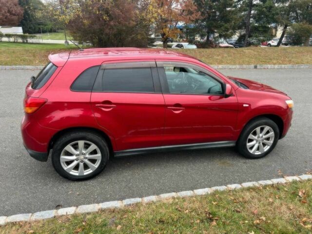 Червоний Міцубісі Аутлендер, об'ємом двигуна 2 л та пробігом 75 тис. км за 9000 $, фото 3 на Automoto.ua