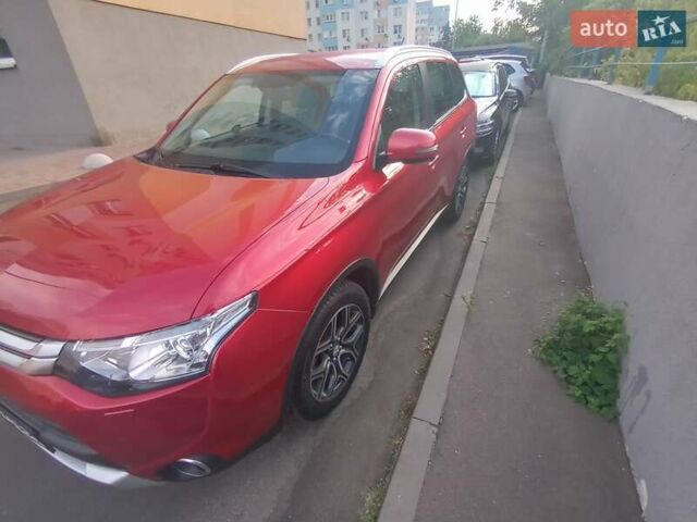 Красный Мицубиси Аутлендер, объемом двигателя 2.38 л и пробегом 206 тыс. км за 13500 $, фото 3 на Automoto.ua