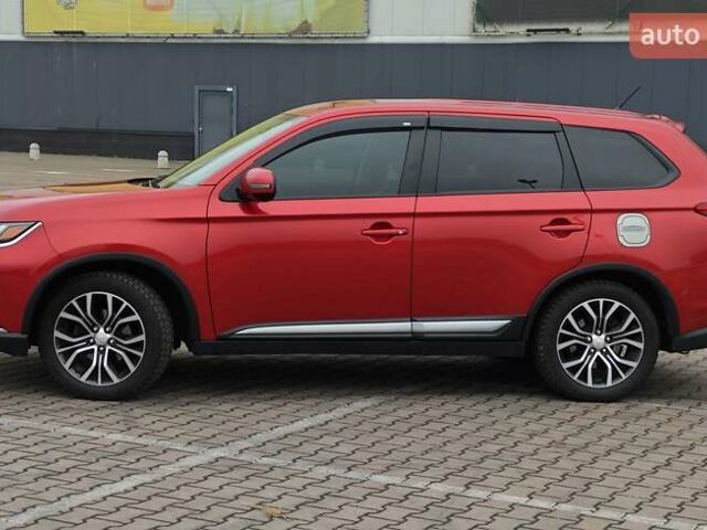 Красный Мицубиси Аутлендер, объемом двигателя 2.36 л и пробегом 123 тыс. км за 15300 $, фото 1 на Automoto.ua