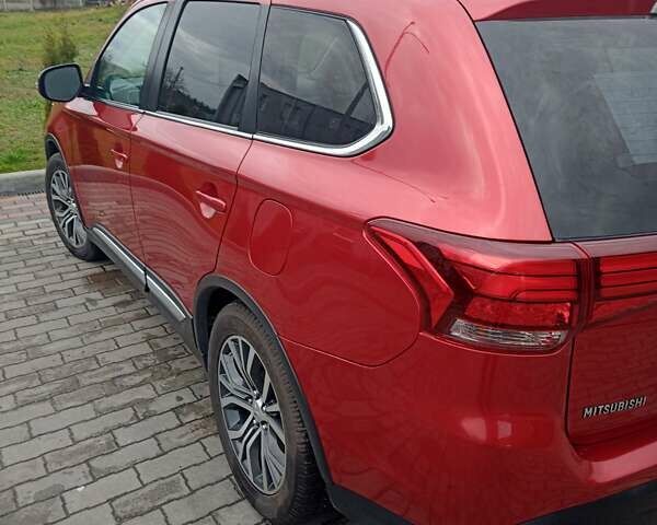 Красный Мицубиси Аутлендер, объемом двигателя 2.36 л и пробегом 131 тыс. км за 16300 $, фото 4 на Automoto.ua