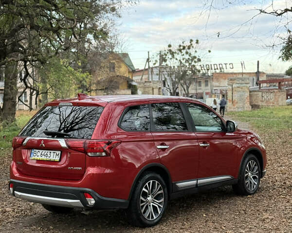 Червоний Міцубісі Аутлендер, об'ємом двигуна 2.36 л та пробігом 190 тис. км за 12000 $, фото 3 на Automoto.ua