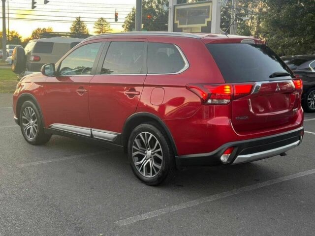 Красный Мицубиси Аутлендер, объемом двигателя 3 л и пробегом 71 тыс. км за 3400 $, фото 3 на Automoto.ua