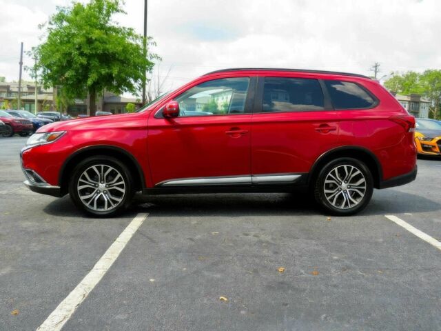 Червоний Міцубісі Аутлендер, об'ємом двигуна 2.4 л та пробігом 71 тис. км за 10800 $, фото 6 на Automoto.ua