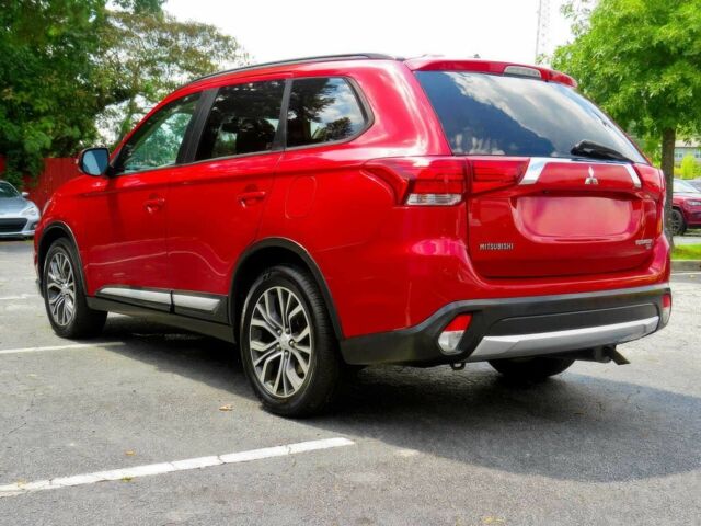 Червоний Міцубісі Аутлендер, об'ємом двигуна 2.4 л та пробігом 71 тис. км за 10800 $, фото 5 на Automoto.ua
