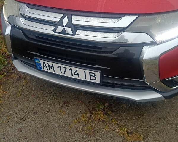 Красный Мицубиси Аутлендер, объемом двигателя 2.36 л и пробегом 131 тыс. км за 16300 $, фото 1 на Automoto.ua