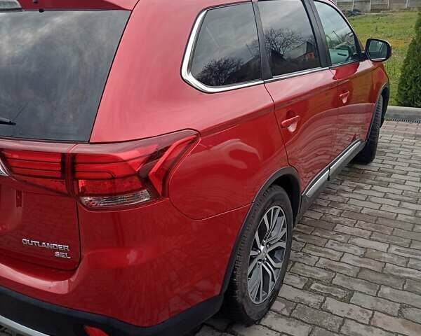 Красный Мицубиси Аутлендер, объемом двигателя 2.36 л и пробегом 131 тыс. км за 16300 $, фото 9 на Automoto.ua