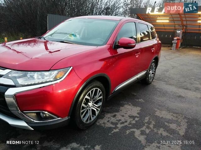 Красный Мицубиси Аутлендер, объемом двигателя 2.36 л и пробегом 118 тыс. км за 14000 $, фото 2 на Automoto.ua