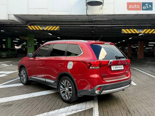 Красный Мицубиси Аутлендер, объемом двигателя 3 л и пробегом 167 тыс. км за 16990 $, фото 4 на Automoto.ua