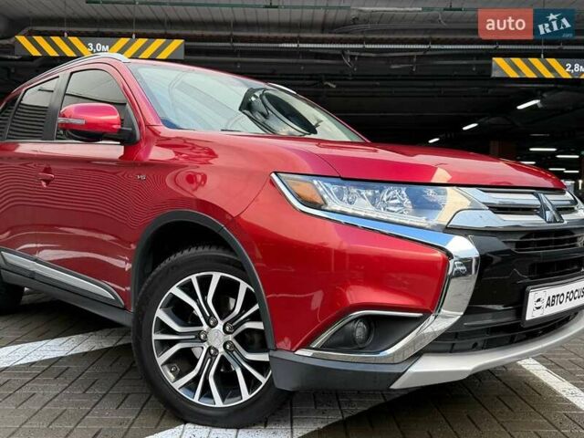 Красный Мицубиси Аутлендер, объемом двигателя 3 л и пробегом 167 тыс. км за 16990 $, фото 1 на Automoto.ua