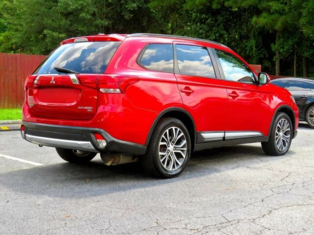 Червоний Міцубісі Аутлендер, об'ємом двигуна 2.4 л та пробігом 71 тис. км за 10800 $, фото 3 на Automoto.ua