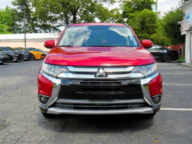 Червоний Міцубісі Аутлендер, об'ємом двигуна 2.4 л та пробігом 71 тис. км за 10800 $, фото 1 на Automoto.ua