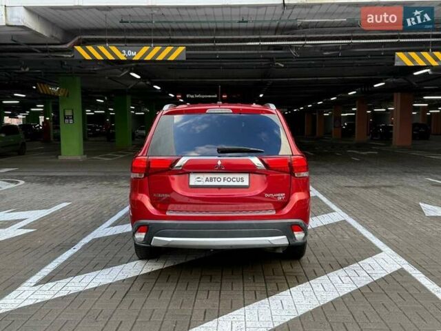 Красный Мицубиси Аутлендер, объемом двигателя 3 л и пробегом 167 тыс. км за 16990 $, фото 5 на Automoto.ua