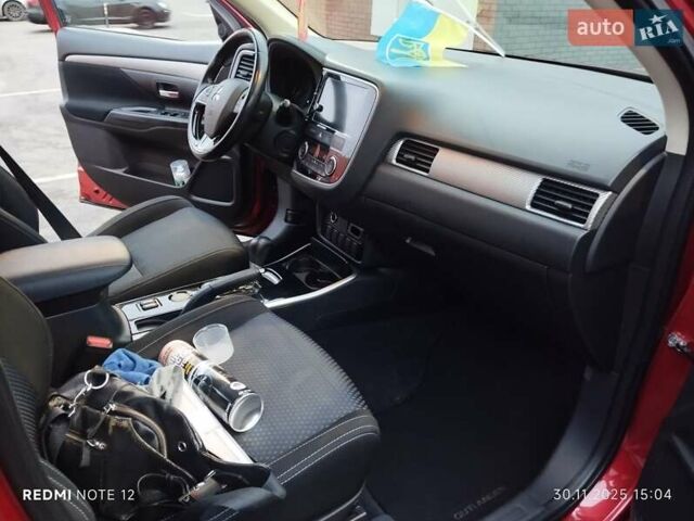 Красный Мицубиси Аутлендер, объемом двигателя 2.36 л и пробегом 118 тыс. км за 14000 $, фото 5 на Automoto.ua