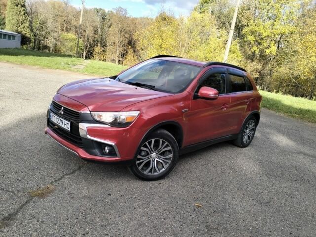 Красный Мицубиси Аутлендер, объемом двигателя 2.4 л и пробегом 185 тыс. км за 12200 $, фото 1 на Automoto.ua