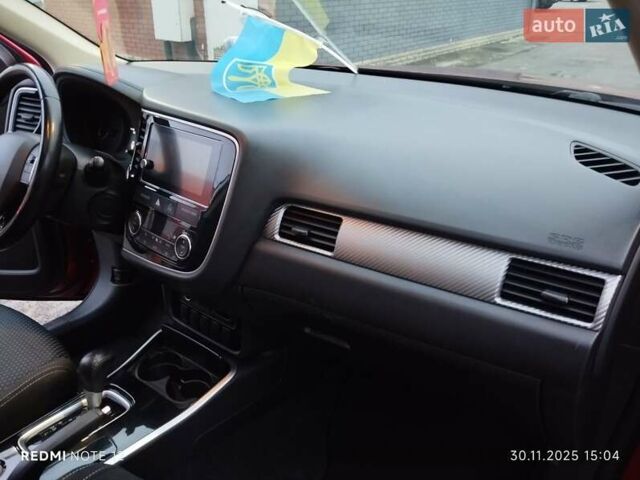 Красный Мицубиси Аутлендер, объемом двигателя 2.36 л и пробегом 118 тыс. км за 14000 $, фото 6 на Automoto.ua