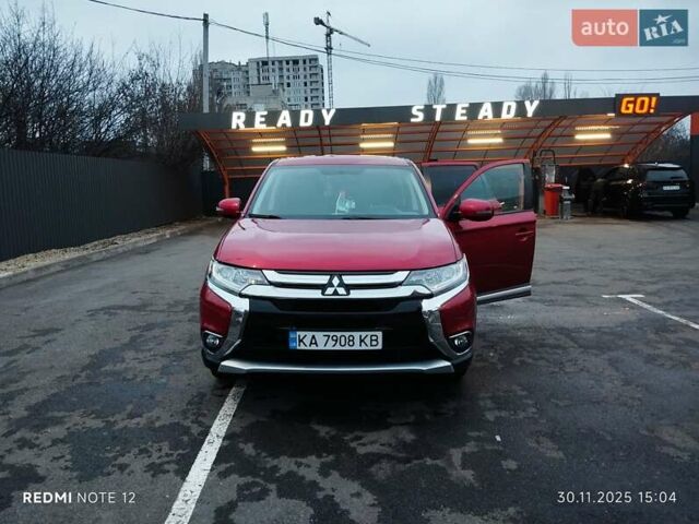 Красный Мицубиси Аутлендер, объемом двигателя 2.36 л и пробегом 118 тыс. км за 14000 $, фото 1 на Automoto.ua
